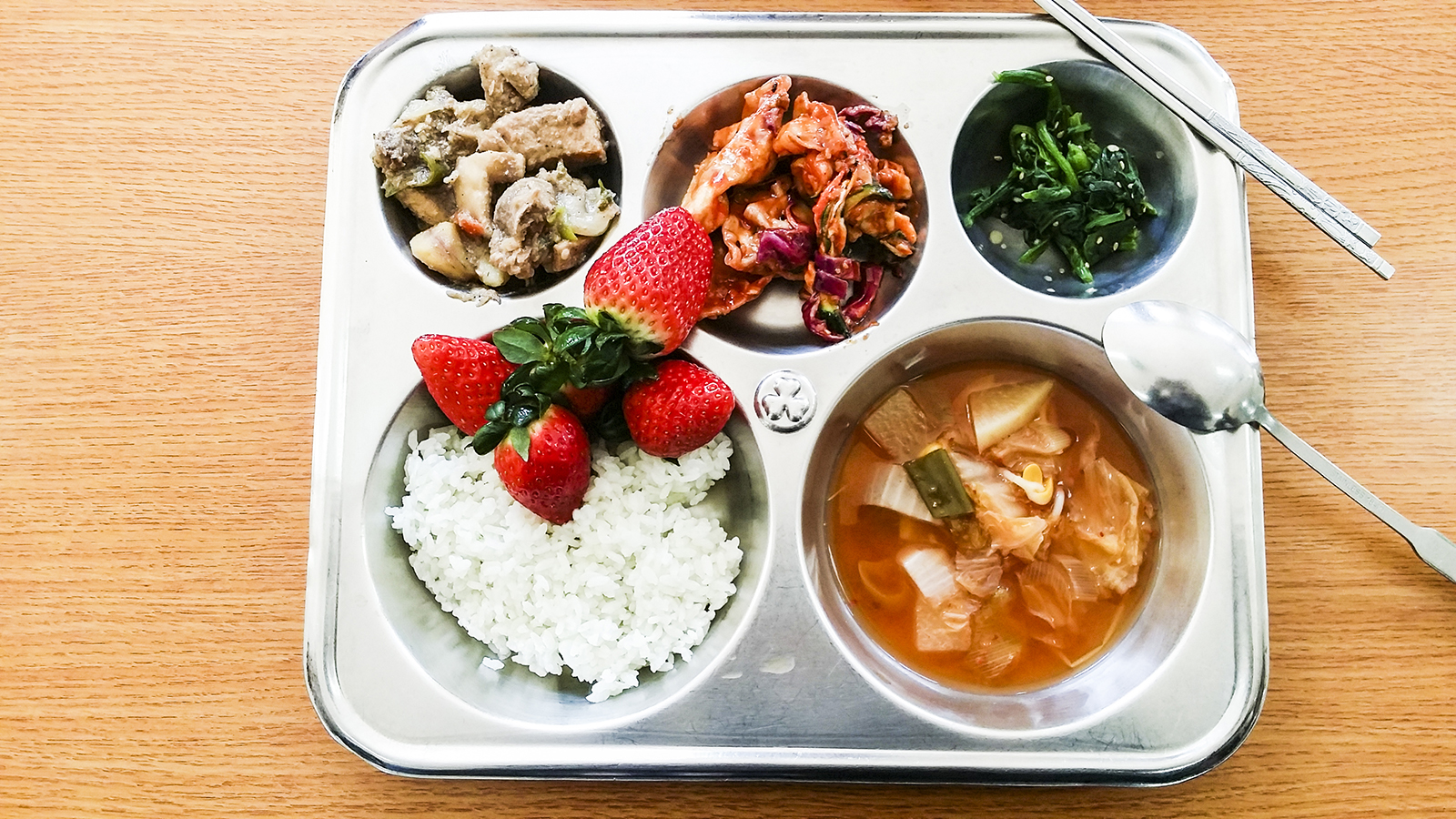 School lunch at middle school in Sangju, South Korea: Kimchi, Strawberries.