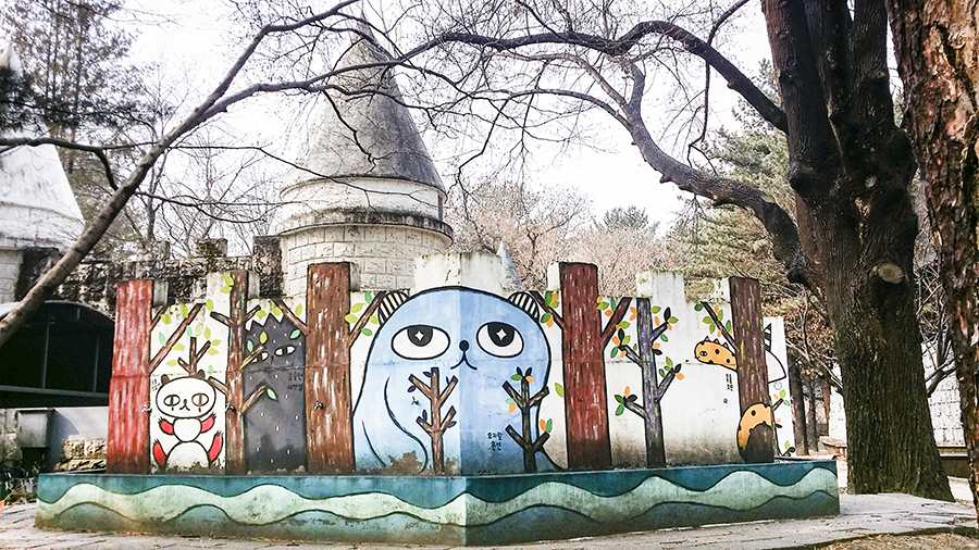 Cute characters on the walls of a castle structure at Nami Island, Gapyeong, South Korea.