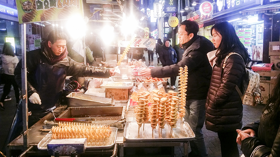 Roadside stall selling twistie potato sticks in Myeongdong, Seoul, South Korea.