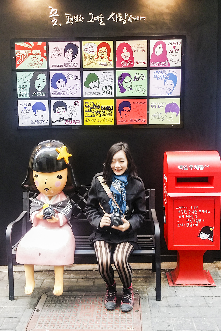 Taking a portrait with a cute statue outside Miss Lee Cafe in Myeongdong, Seoul, South Korea.