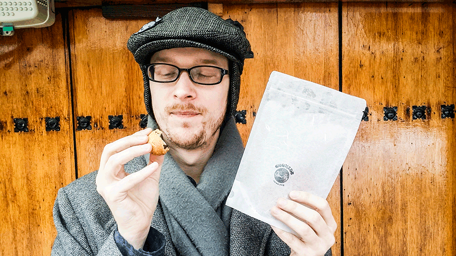 Animated gif of Ottie enjoying chocolate cookies from Jung Ae Cookies in Bukchon, South Korea.
