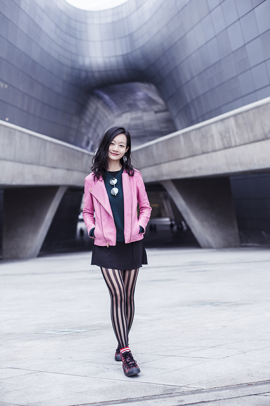 Outfit at Dongdaemun Design Plaza: Viparo pink lambskin leather jacket, H&M green merino wool sweater, H&M Divided black chiffon dress, Nordstrom black striped tights, Taobao mirror circle sunglasses, Alexander McQueen x Puma high top sneakers. Photo taken by Ottie.