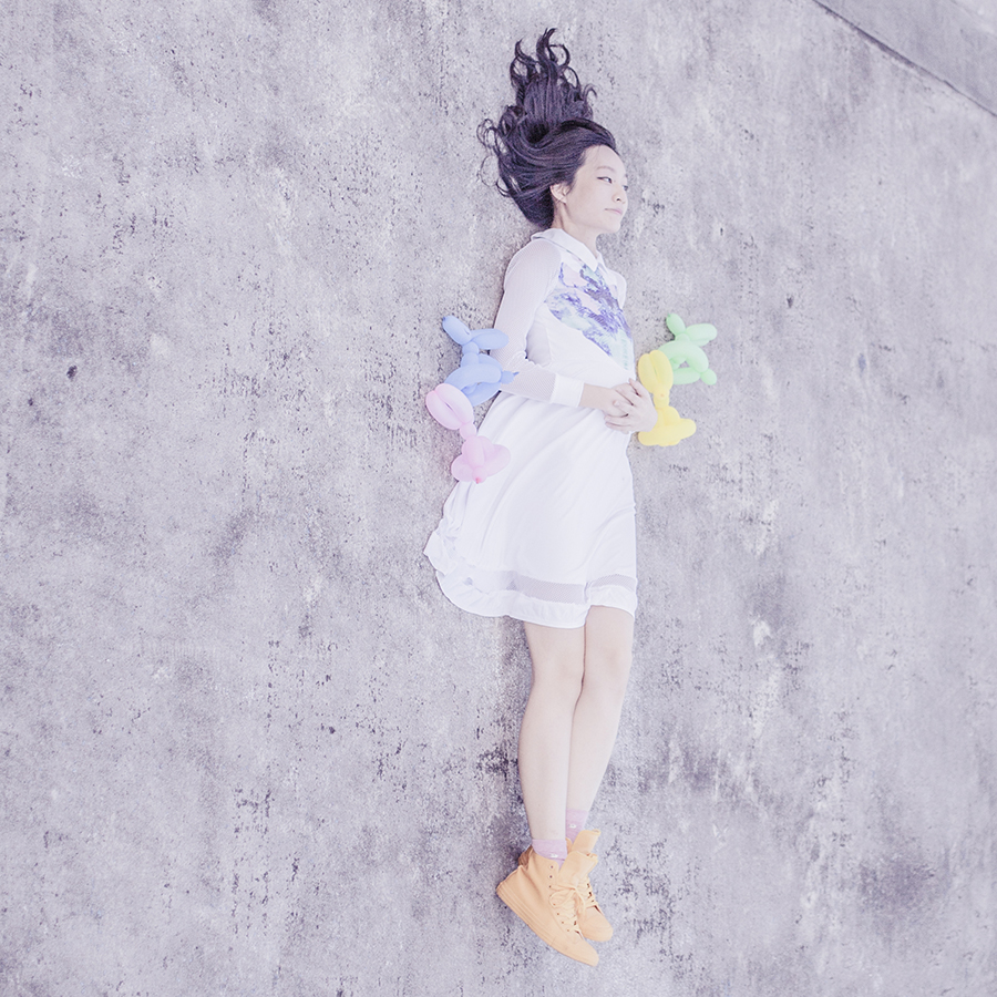Pastel easter outfit: Kae Hana white mesh rorschach dress, Converse yellow rubber coated sneakers, pastel balloon animal bunnies.