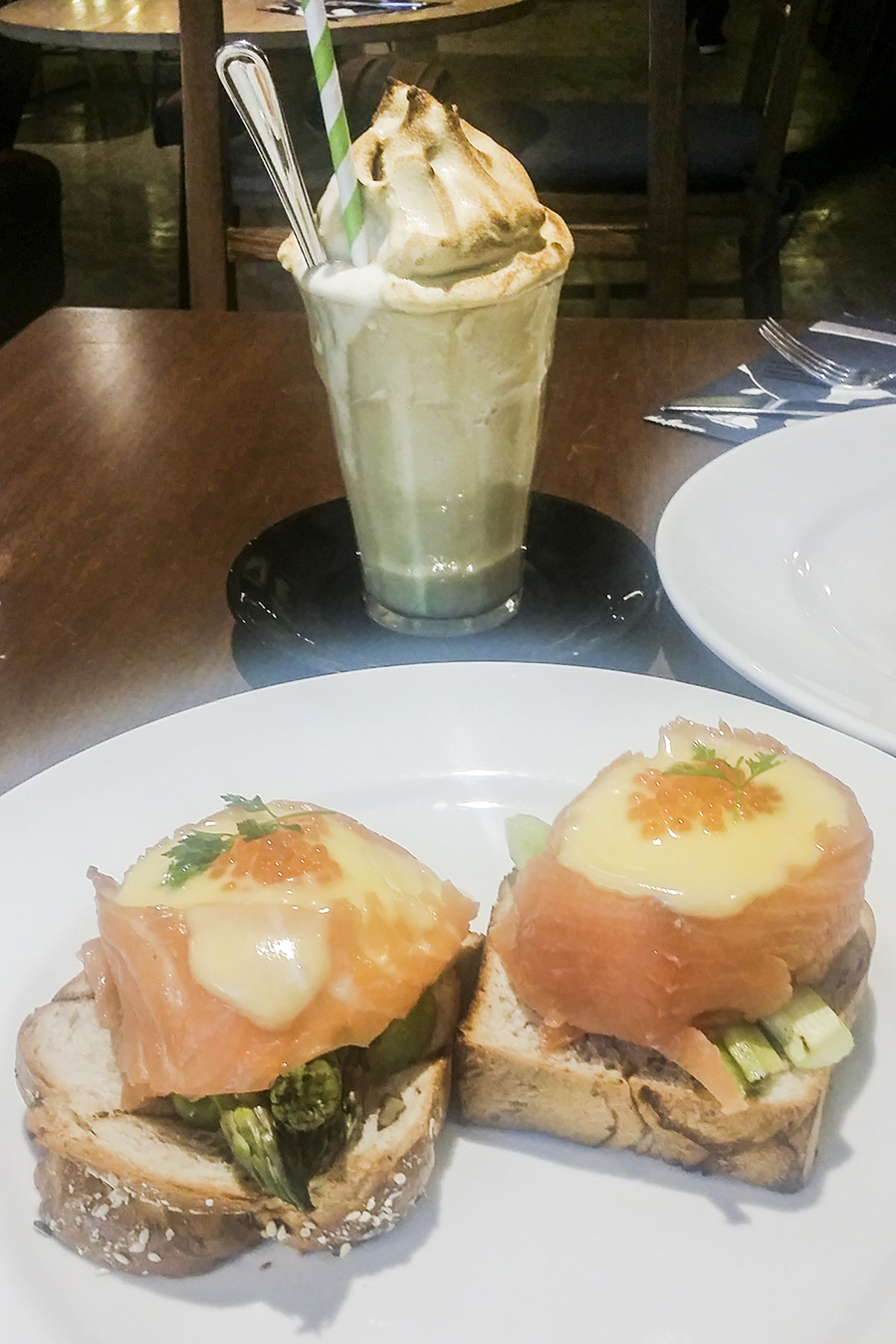 Norwegian breakfast with eggs benedict wrapped in salmon and asparagus, Banana shake at Wild Honey, Singapore.