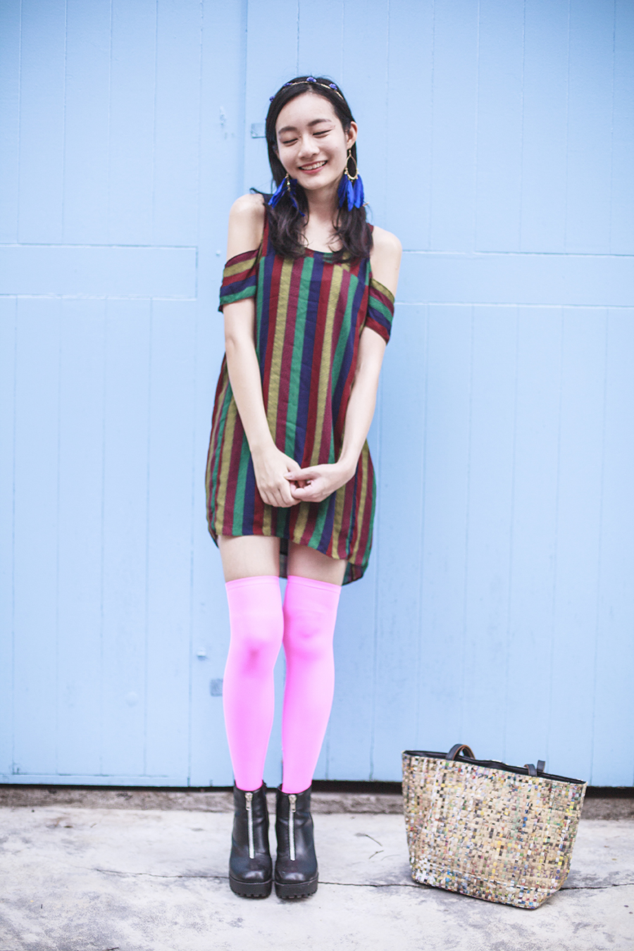 Bohemian Rhapsody Outfit: Urban Outfitters striped off-shoulder dress, We Love Colors neon pink thigh high stockings, Rubi black platform zipper boots, paper floral headband from Bangkok, H&M blue feather hoop earrings, manga strips tote bag from Hong Kong.