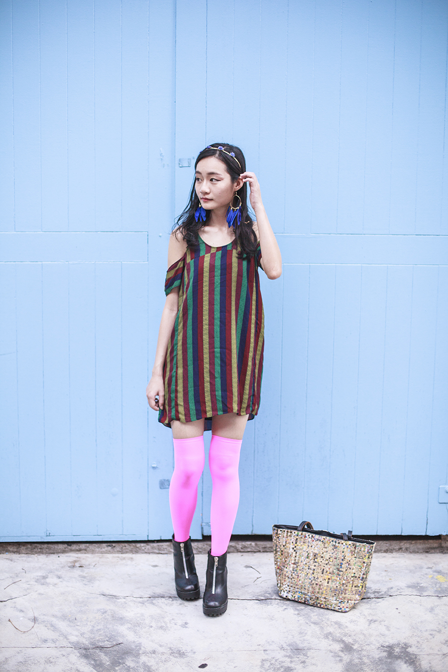 Bohemian Rhapsody Outfit: Urban Outfitters striped off-shoulder dress, We Love Colors neon pink thigh high stockings, Rubi black platform zipper boots, paper floral headband from Bangkok, H&M blue feather hoop earrings, manga strips tote bag from Hong Kong.