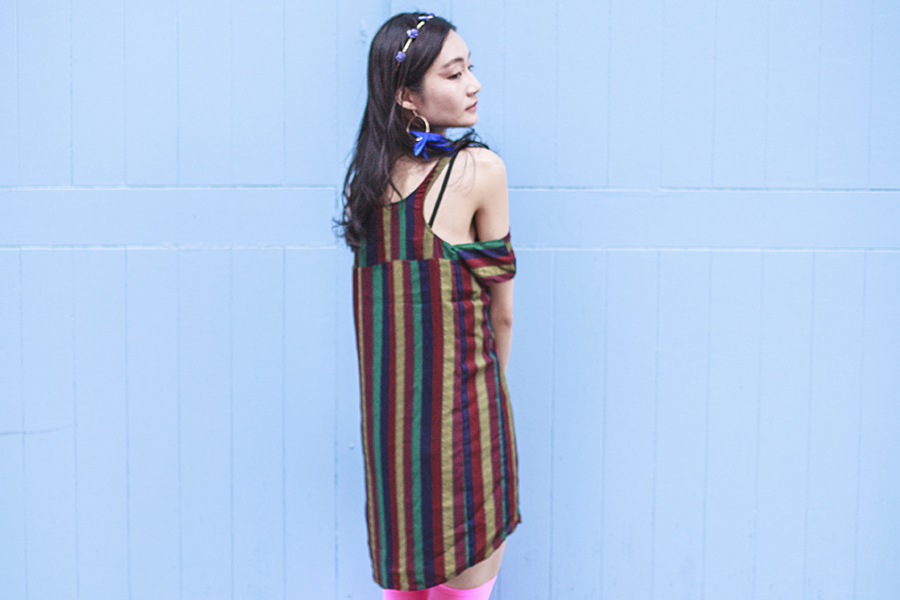 Bohemian Rhapsody Outfit: Urban Outfitters striped off-shoulder dress, We Love Colors neon pink thigh high stockings, paper floral headband from Bangkok, H&M blue feather hoop earrings.