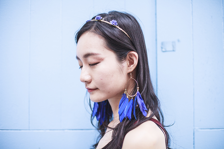 Bohemian Rhapsody Outfit: paper floral headband from Bangkok, H&M blue feather hoop earrings.