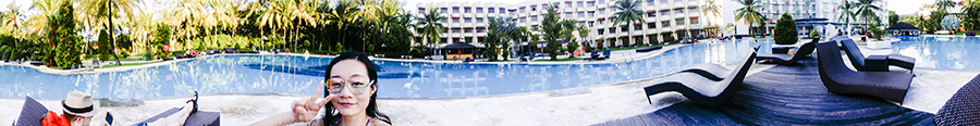 Panoramic view of the pool while lounging at Harris Waterfront Resort, Batam, Indonesia.