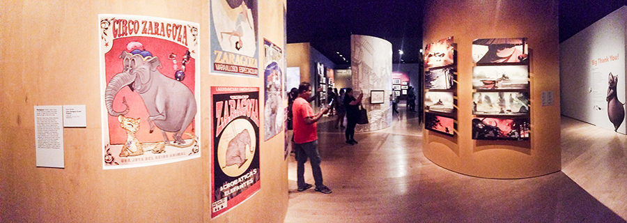 Exhibition panels displaying posters and artworks at the DreamWorks Animation: The Exhibition at the ArtScience Museum in Marina Bay Sands, Singapore.