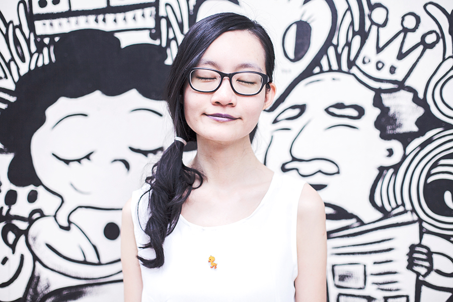 Casual Outfit: DressLink open back white chiffon top, Gap black frame glasses, L.A. Colors purple lipstick, Vintage duckie wooden pin. Against a Band of Doodlers wall mural in Macpherson, Singapore.