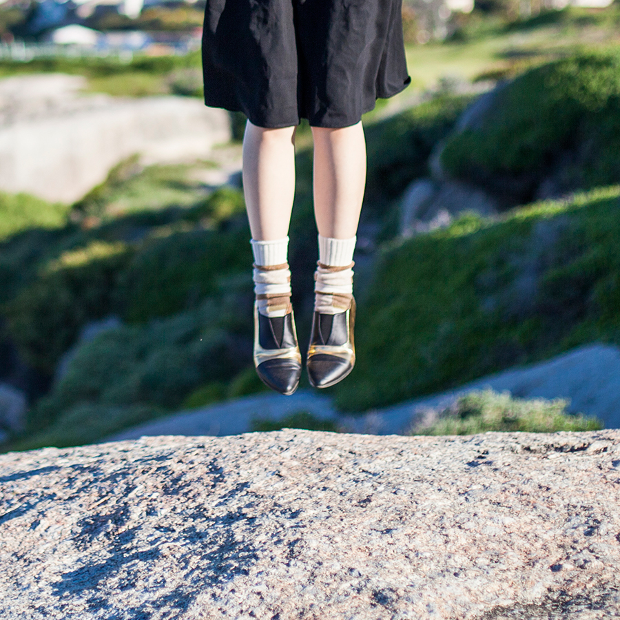 Outfit at Boulders Beach, Table Mountain National Park, Cape Town, South Africa: Lowry's Farm black midi skirt with pockets, Anonymous Ism patchwork crew socks via Shopbop, Something Borrowed black & gold pointed flats via Zalora.