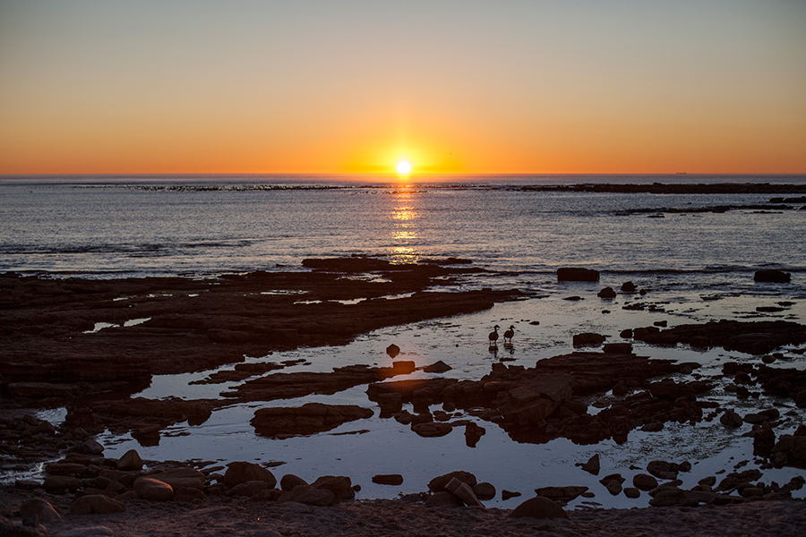 Sunset at False Bay by Rocky Shores, Hout Bay, Cape Town, South Africa.