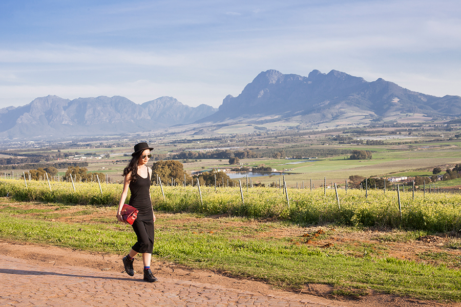 Outfit at Fairview Wine and Cheese, South Africa: Newdress black side slit dress, Dressin silver mirror sunglasses, Dressgal red satchel handbag, Stance warrior crew socks via Shopbop, Zalora PU black high top sneakers, Taobao black hat.