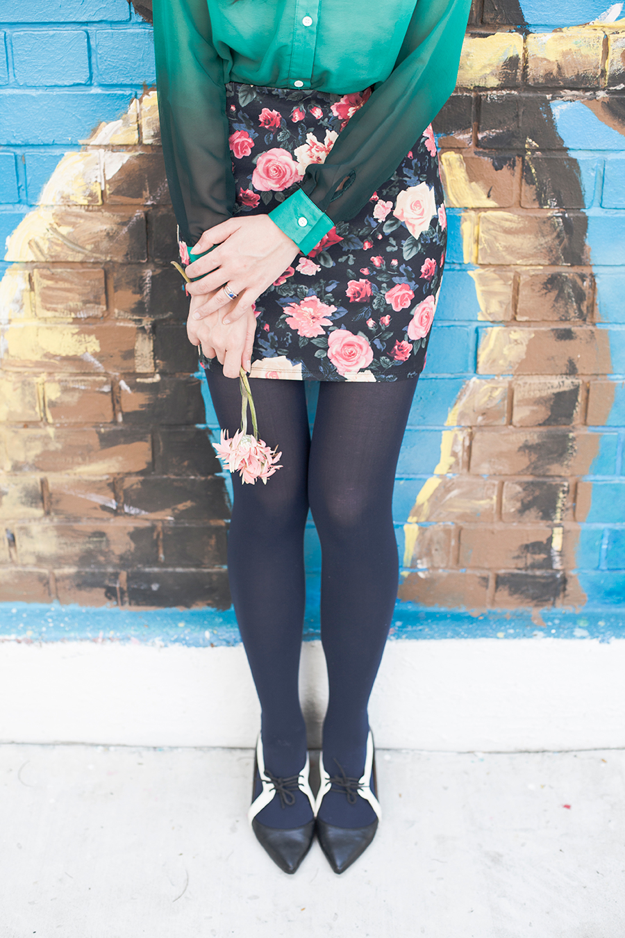 Holding onto pink flowers in a floral ootd.