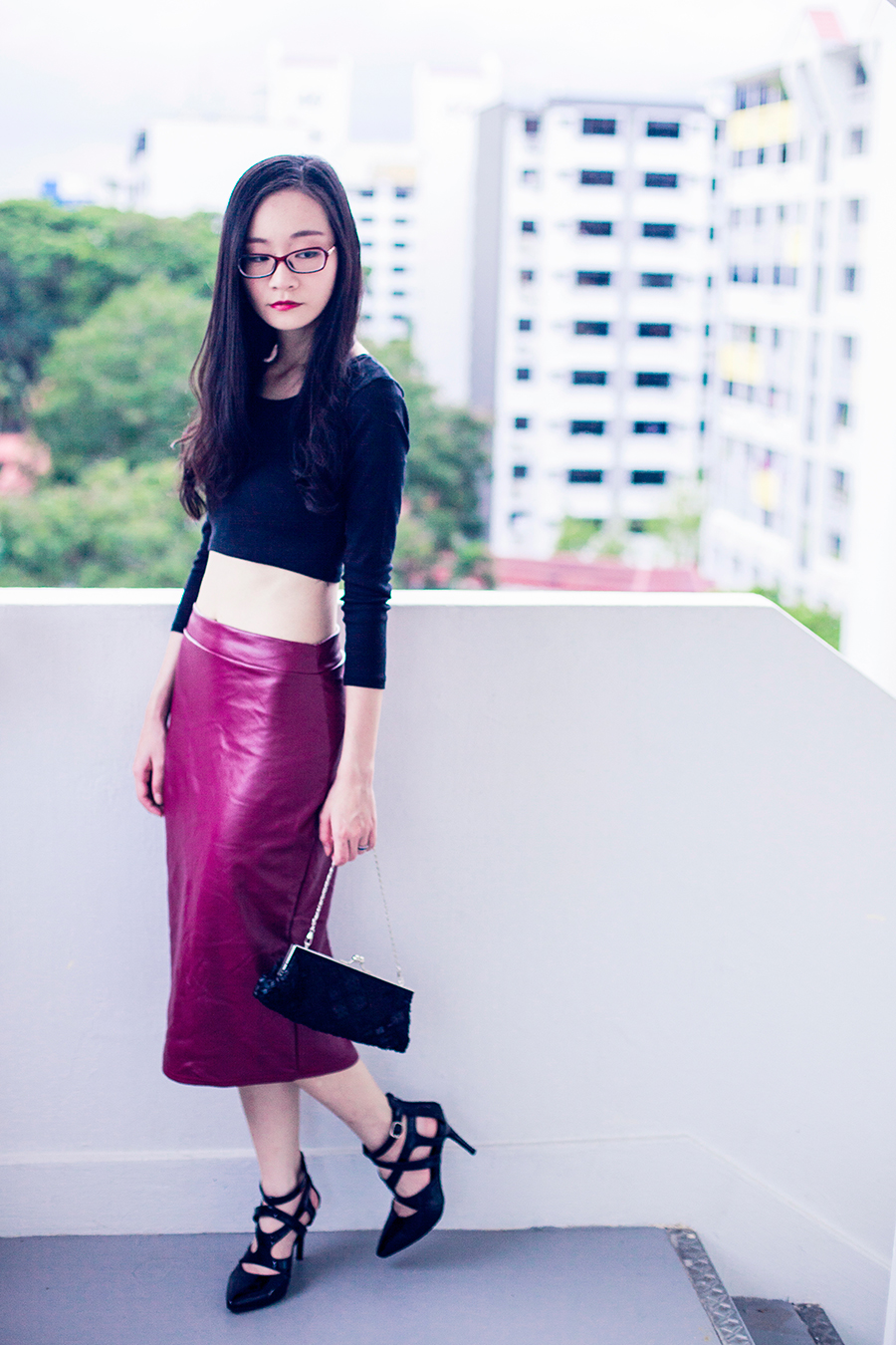 Crop top and midi leatherette skirt. Chomel black sequin purse.