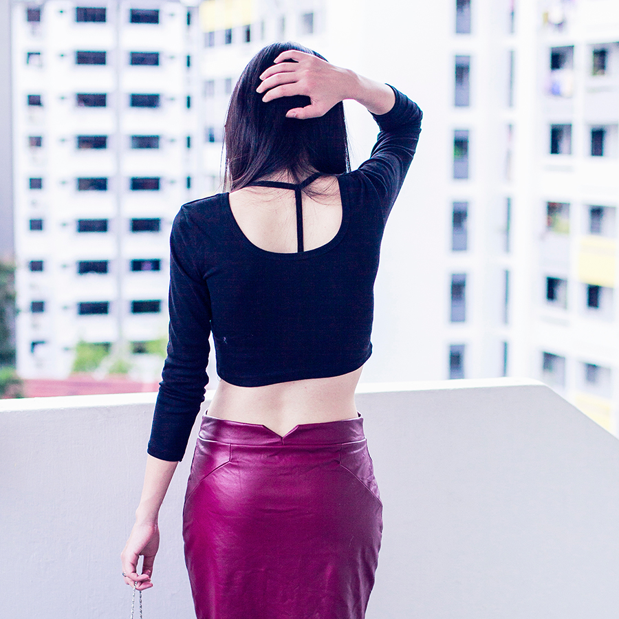 Crop top and midi leatherette skirt.