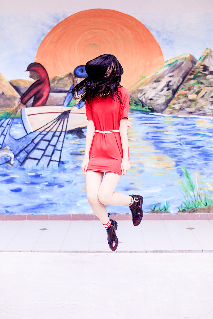 Levitation photo wearing crimson Red tunic dress for Chinese New Year of the Monkey.