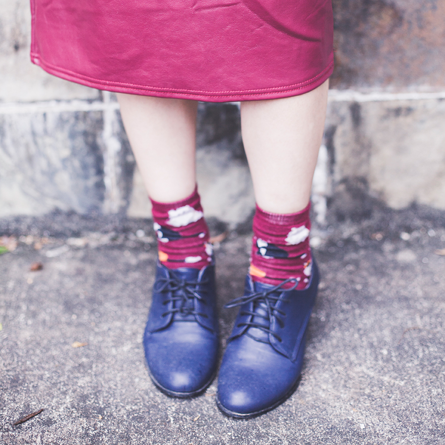 Cat socks and navy blue oxford heels.