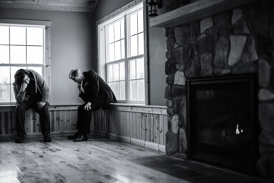 Jeff the Best Man and Groom Ottie in a Thinker stance by the fireplace.