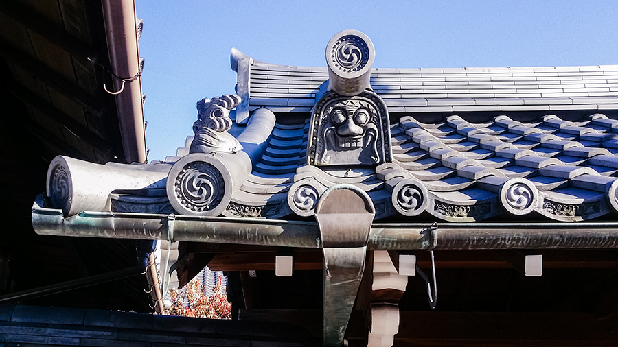 Face on a roof tile at Fushimi Inari, Kyoto Japan.