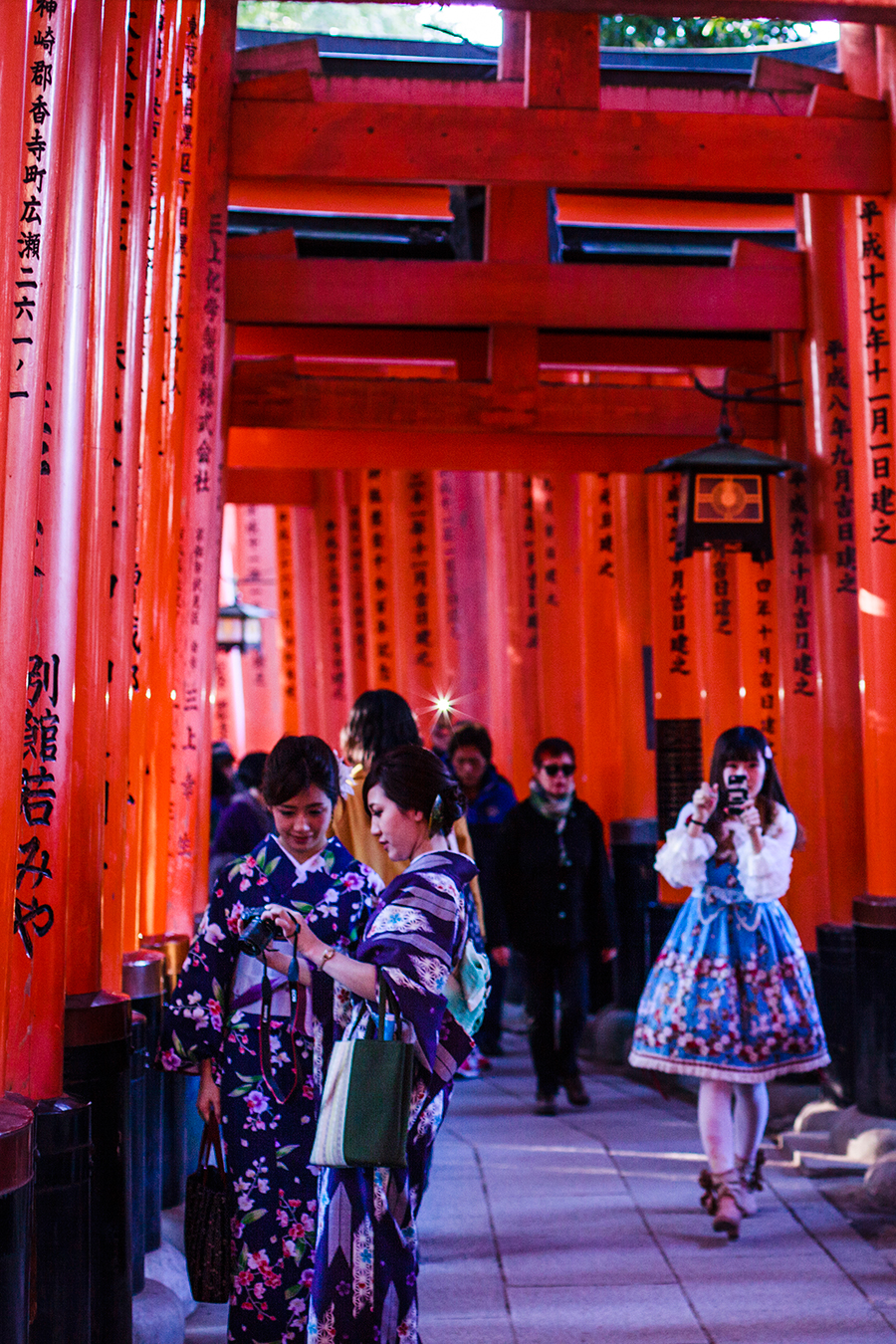 Japanese tourists at Fushimi Inari in Kyoto, Japan.