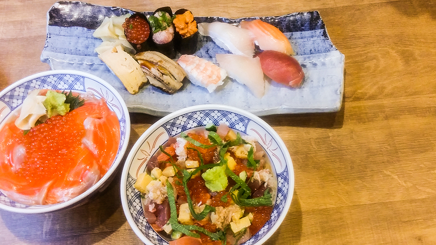 Sushi, Shake Oyako Don, and Chirashi Don at Isomaru Suisan in Tokyo, Japan.