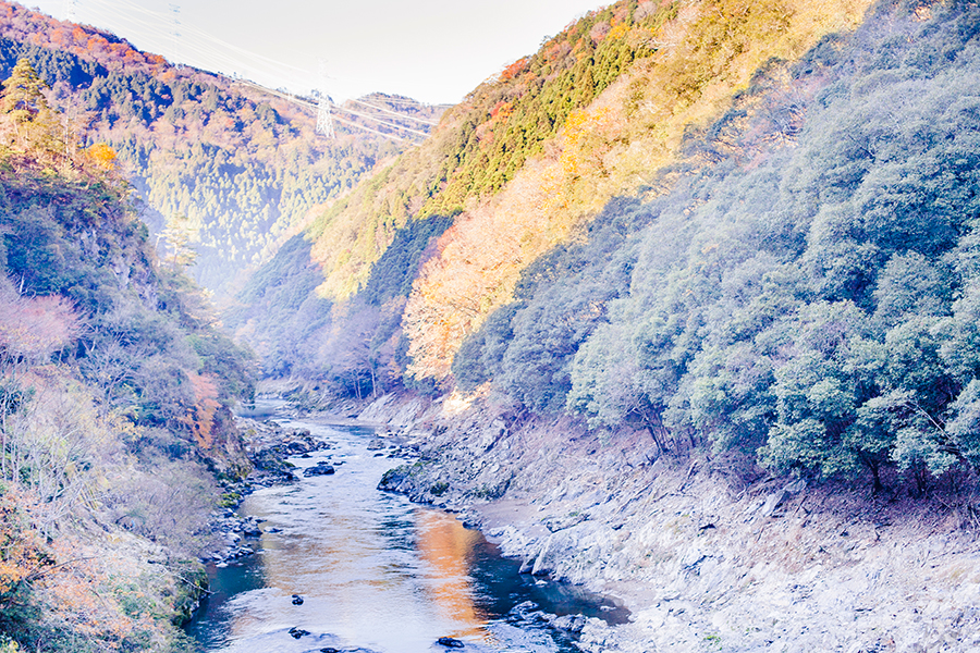 Autumn leaves on mountains and valleys at Hozugawa River, Kyoto, Japan.
