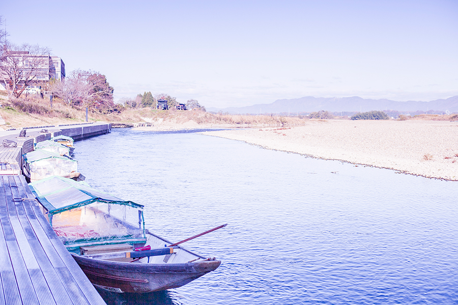 Boats lined up at Hozugawa River, Kyoto, Japan.