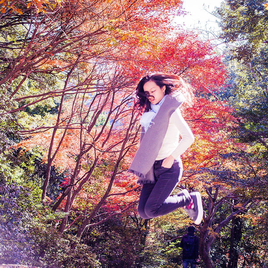 Levitation among autumn leaves at Arashiyama, Kyoto, Japan.