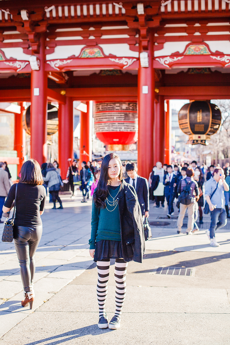 Black and white striped thigh high socks and H&M outerwear at Asakusa, Tokyo Japan.
