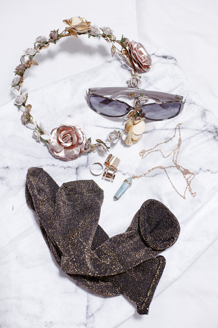 Accessories flatlay: River Island metallic headband, Topshop glitter socks, ALDO green pendant necklace, Forever 21 gold rings, Snupped white marble drawstring bag