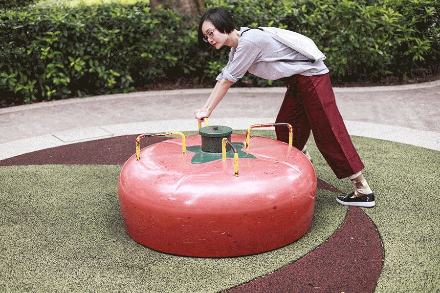 Animated gif of me pushing an old tomato merry-go-round.