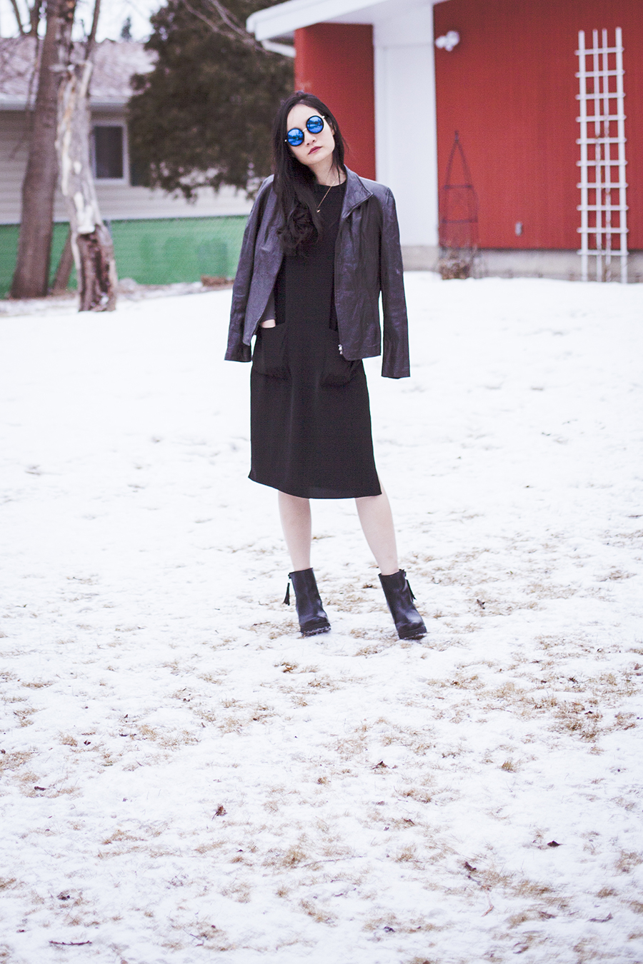 Monochrome winter outfit: P.Rossa black leather jacket, Forever 21 black dress, DealSale amethyst necklace, Uniqlo Heattech top, Steve Madden black tassel heel boots, CNDirect blue sunglasses.