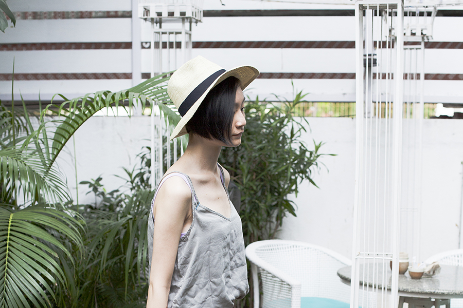 Shopping in India outfit: Cotton On top, Uniqlo UV straw hat.