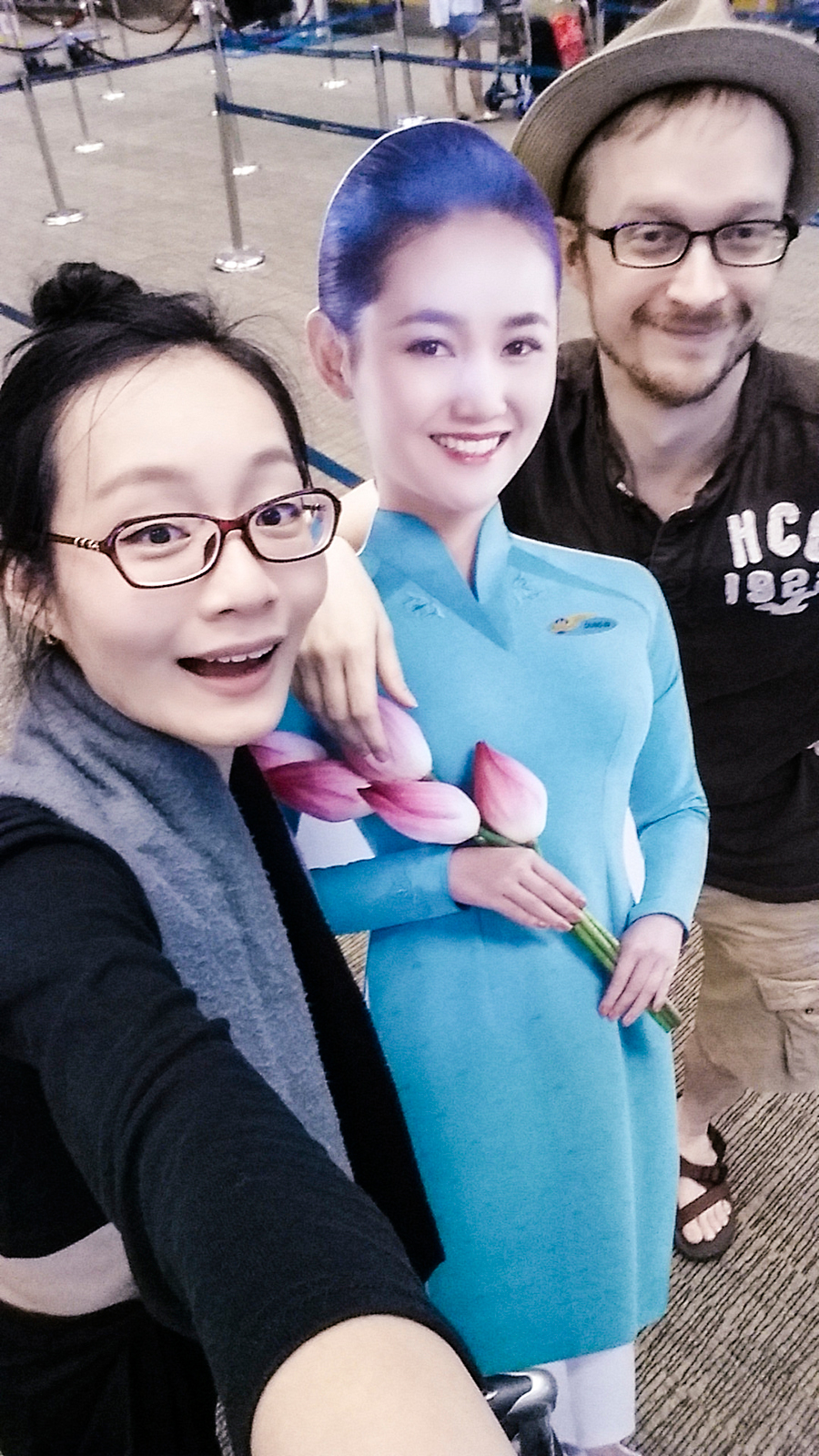 Selfie with a cardboard cutout from Vietnam Airlines at Singapore Changi Airport.