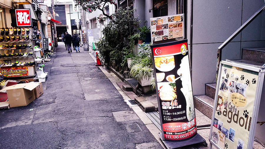 Singapore food signage in an alley in Osaka, Japan.