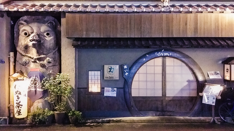 Giant Tanuki sculpture outside a tea house in Osaka, Japan.