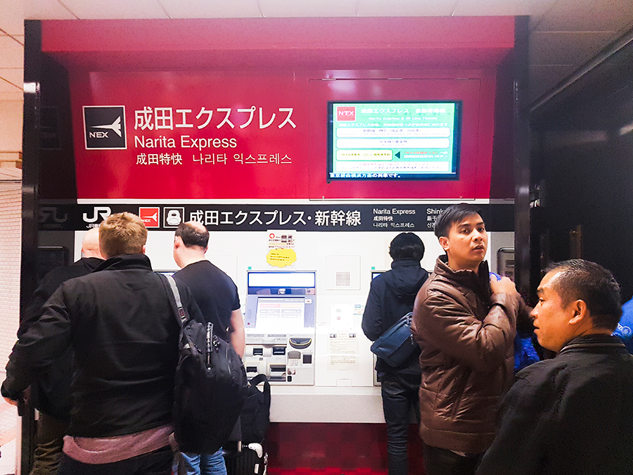Buying a Narita Express ticket at the automated machines at Narita Train station.