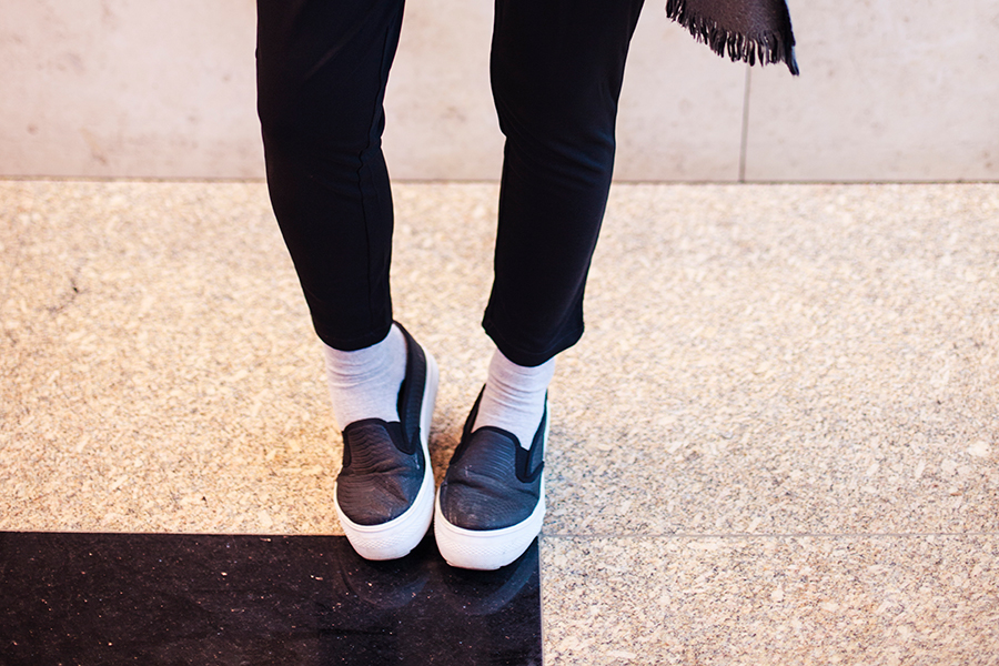 Black monochrome outfit for traveling: WholeSaleBuying black harem pants, Spurr shoes.