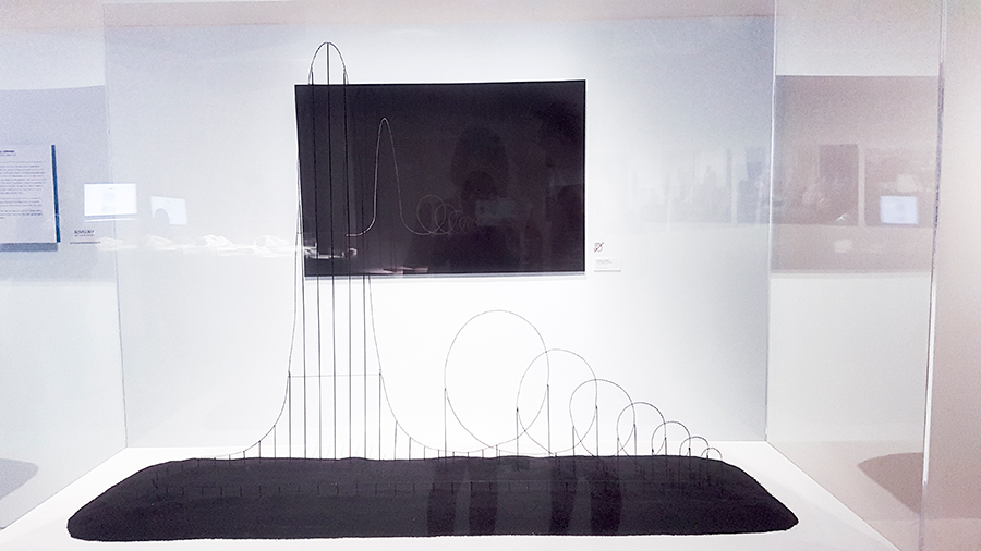 Scaled mockup and technical drawing of the Euthanasia Coaster at the HUMAN+ The Future of Our Species exhibition, ArtScience Museum Singapore.
