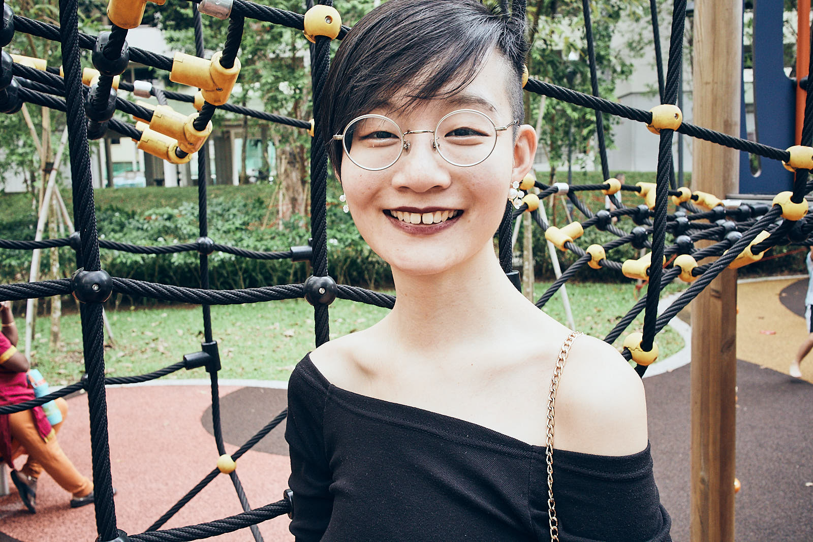 Portrait in black circle lenses.