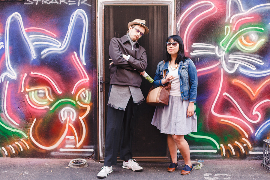 Ottie and Kooling posing in front of a neon lights mural in Perth Australia.
